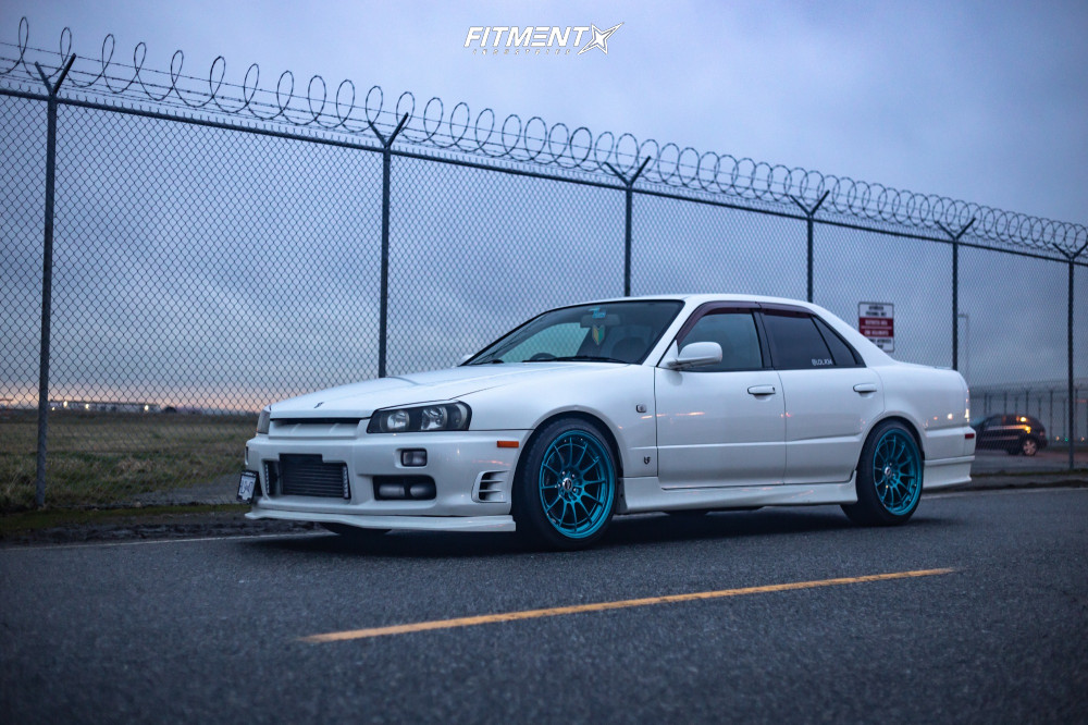 1999 Nissan Skyline R34 Base with 18x9.5 Enkei Nt03m and Rydanz