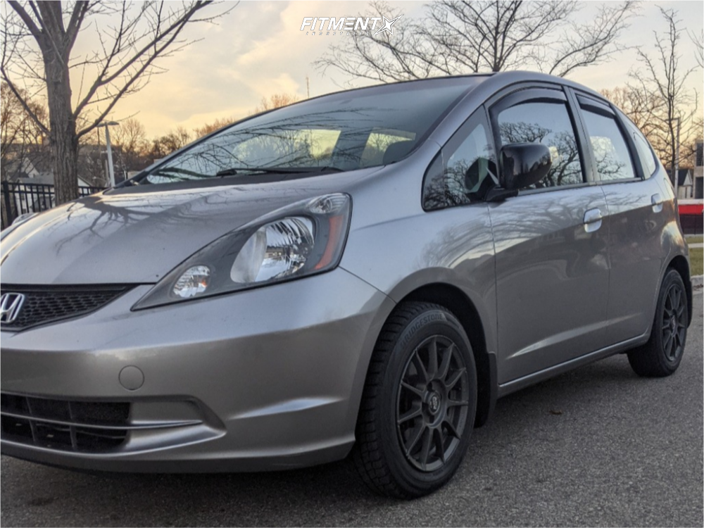 2009 Honda Fit Base with 15x6 MSW Type 85 and Bridgestone